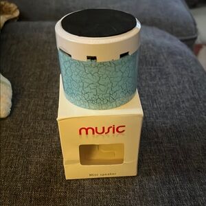 Blue and White Portable Bluetooth Speaker with Compact Design